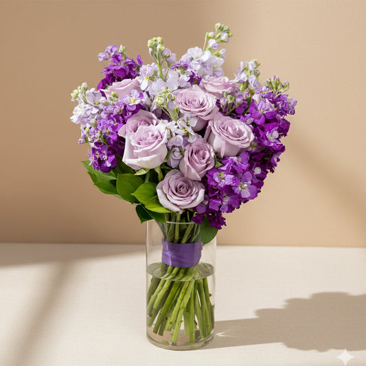 Purple roses & stock with vase